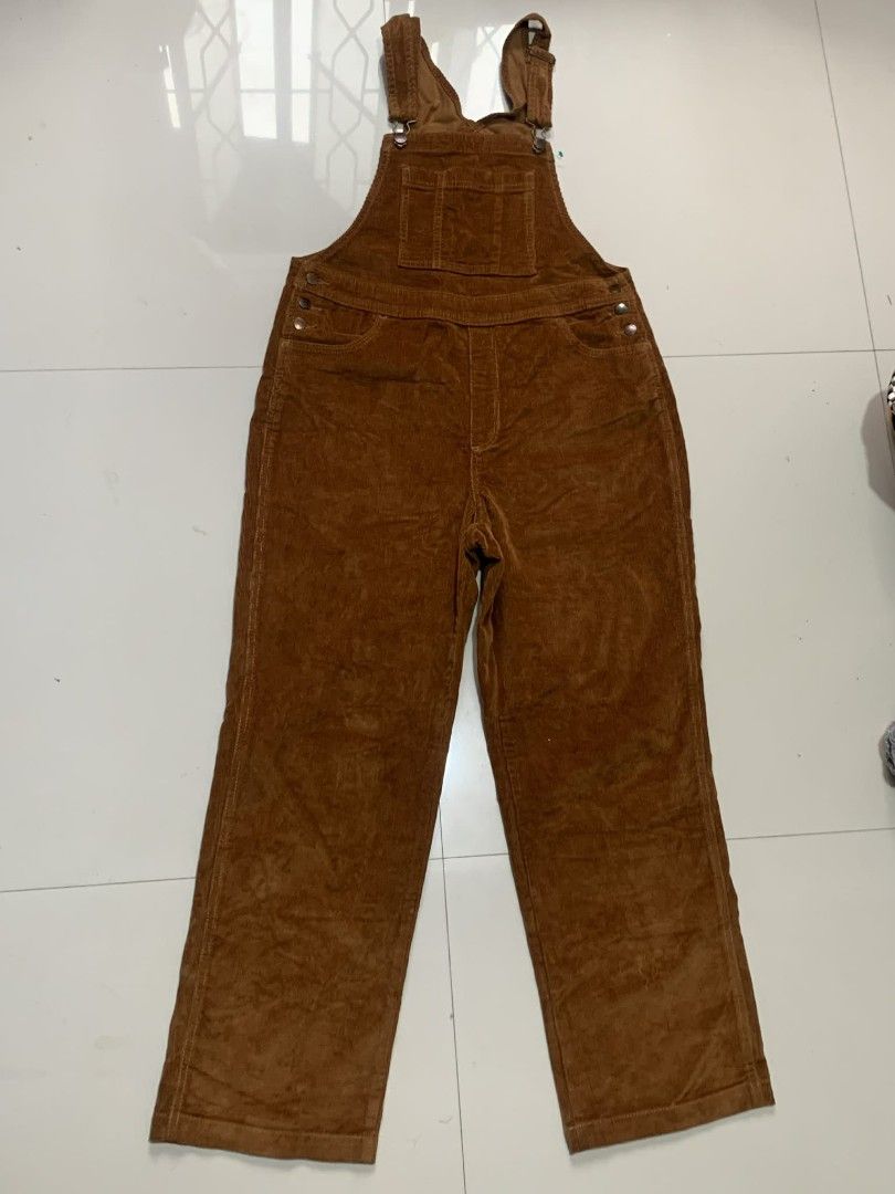 Corduroy Overalls - Brown (Category: Jumpsuits) located in Cabuyao City. Submitted by burberrymaki (Listing ID 1438226427, Image 2). Description: - Brown corduroy overalls - Adjustable straps - Multiple pockets - Metal button closures - Straight leg design - Soft corduroy material - Classic, timeless style.