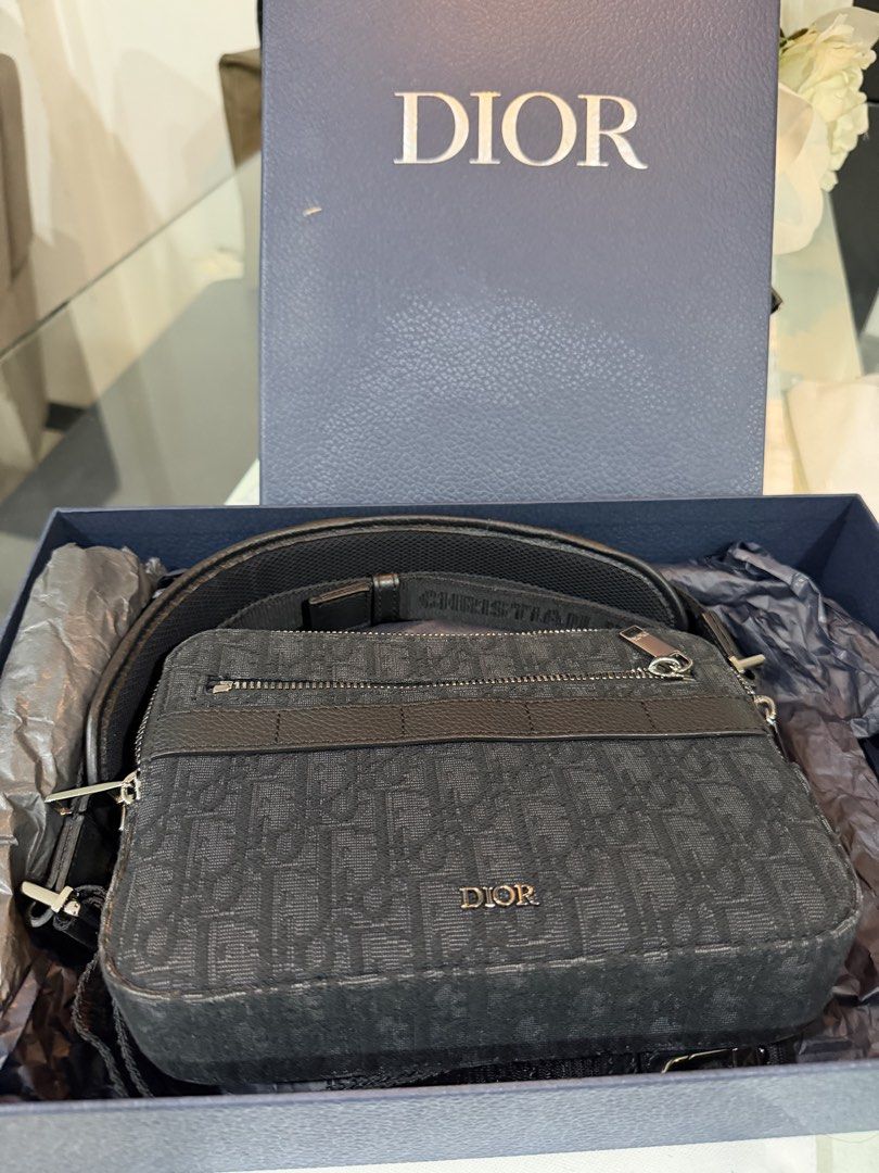 Dior Oblique Canvas Crossbody Bag (Category: Luxury Bags & Wallets) located in Quezon City. Submitted by dreigeraldez (Listing ID 1438216842, Image 1). Description: - Authentic Dior Oblique crossbody bag - Features the iconic black Dior Oblique pattern - Silver-tone hardware - Secure zip closure - Adjustable strap for comfortable wear - Spacious interior for essentials - Comes with the original box - Perfect for any occasion Good as new. .