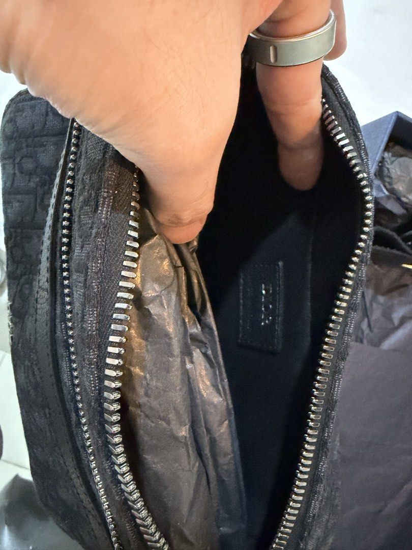 Dior Oblique Canvas Crossbody Bag (Category: Luxury Bags & Wallets) located in Quezon City. Submitted by dreigeraldez (Listing ID 1438216842, Image 3). Description: - Authentic Dior Oblique crossbody bag - Features the iconic black Dior Oblique pattern - Silver-tone hardware - Secure zip closure - Adjustable strap for comfortable wear - Spacious interior for essentials - Comes with the original box - Perfect for any occasion Good as new. .