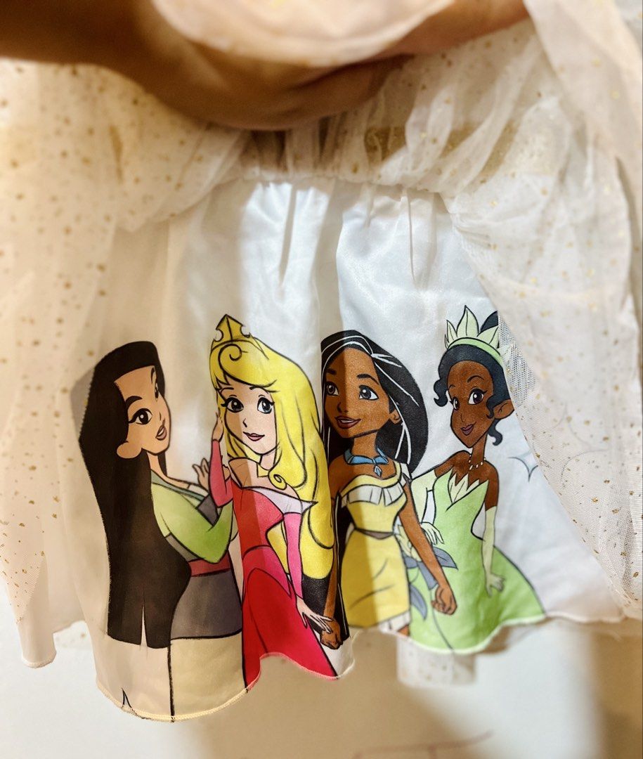 Disney Princess Dress 2T (Category: Babies & Kids Fashion) located in Quezon City. Submitted by kjudz (Listing ID 1438156530, Image 3). Description: - Disney Princess dress, size 2T - White bodice with "Princess" in pink and gold - White tulle skirt with gold glitter and princess graphics - Gold waistband - Made of 90% polyester and 10% spandex - Used once.
