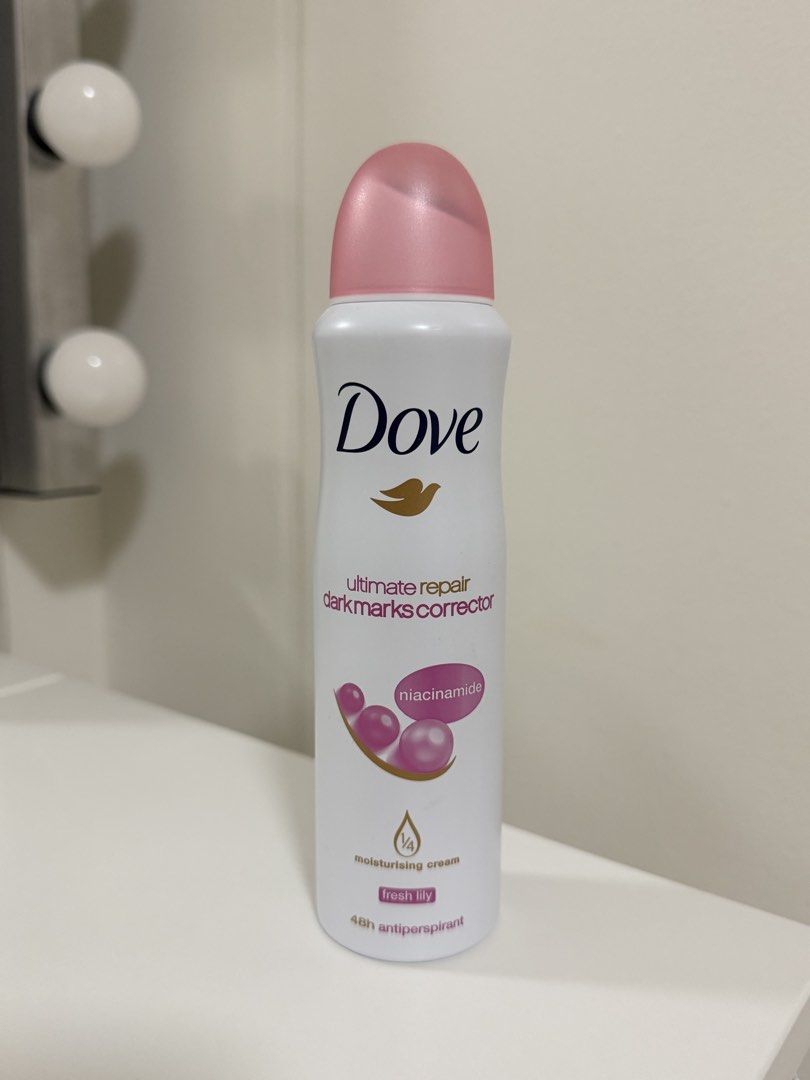 Dove Ultimate Repair Dark Marks Corrector Antiperspirant (Category: Fragrance & Deodorants) located in Quezon City. Submitted by Cells_Collection (Listing ID 1438245016, Image 1). Description: - Dove Ultimate Repair Dark Marks Corrector - Contains niacinamide - Fresh lily scent - Provides 48-hour antiperspirant protection - Helps repair and correct dark marks - Features 1/4 moisturizing cream - White bottle with pink cap.