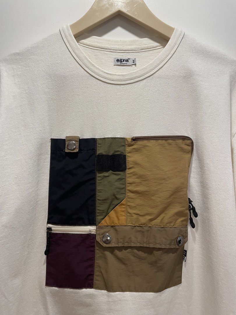 Egrn Tokyo Japan Patchwork Pocket T-shirt (Category: Tshirts & Polo Shirts ) located in Bacolod City. Submitted by moboandmoga (Listing ID 1438191761, Image 3). Description: - Egrn Tokyo Japan T-shirt - Unique patchwork pocket design - Size: M (Size 2) - Color: Off-white - Main Body: 100% Cotton - Patchwork: 60% Cotton, 40% Nylon - Pocket features multiple compartments and zippers (Sizing info) Width: 21.5 inches Length: 26.5" Excellent Condition