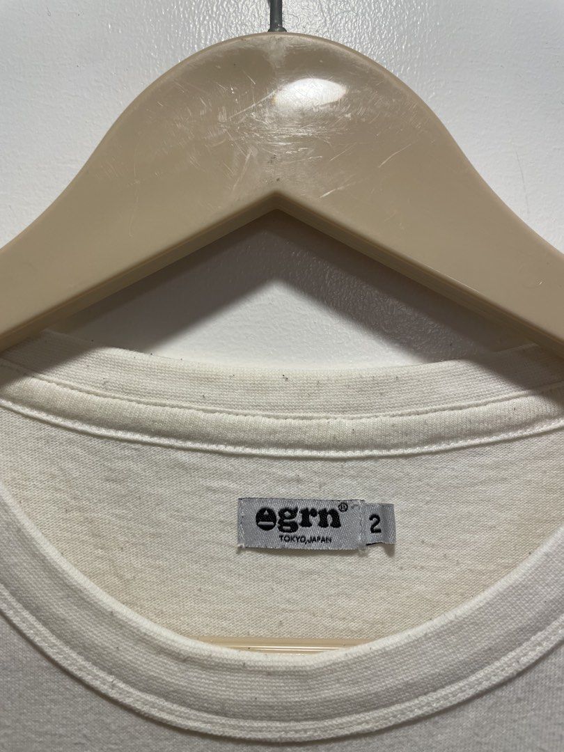 Egrn Tokyo Japan Patchwork Pocket T-shirt (Category: Tshirts & Polo Shirts ) located in Bacolod City. Submitted by moboandmoga (Listing ID 1438191761, Image 2). Description: - Egrn Tokyo Japan T-shirt - Unique patchwork pocket design - Size: M (Size 2) - Color: Off-white - Main Body: 100% Cotton - Patchwork: 60% Cotton, 40% Nylon - Pocket features multiple compartments and zippers (Sizing info) Width: 21.5 inches Length: 26.5" Excellent Condition