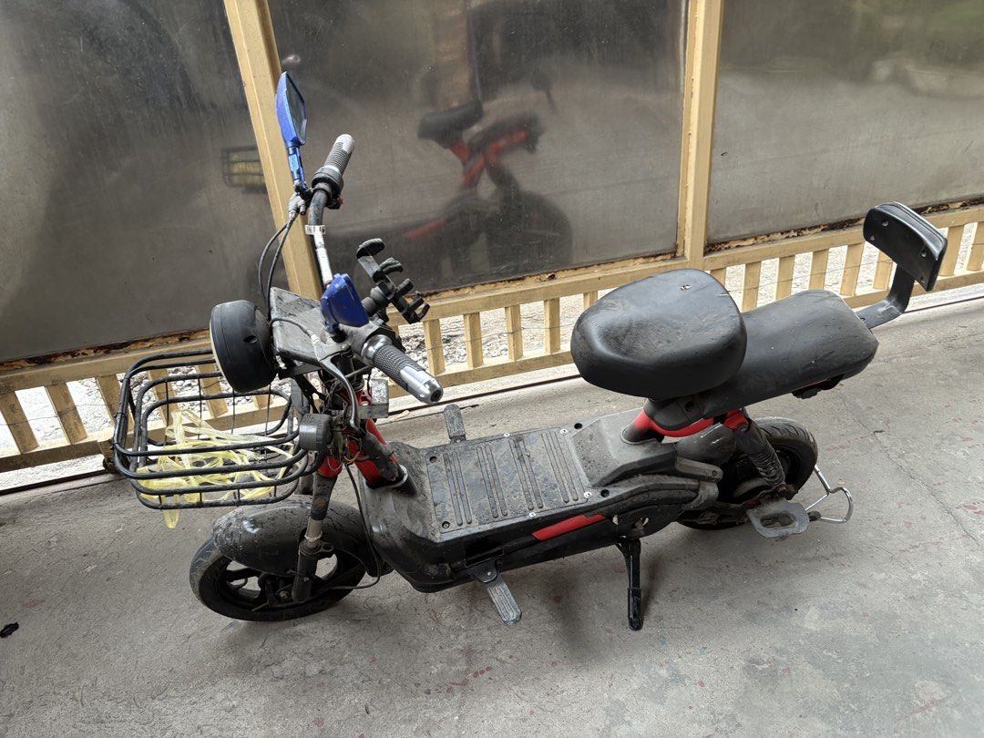 Electric Scooter with Basket and Mirrors (Category: Bicycles) located in Manila. Submitted by karengrace_27 (Listing ID 1438231331, Image 2). Description: - Red and black electric scooter - Front basket included - Features blue side mirrors - Comfortable black seat with backrest - Round headlight - Handlebar for easy steering - Convenient footrests - Sturdy kickstand - Functional and ready for use -charger.