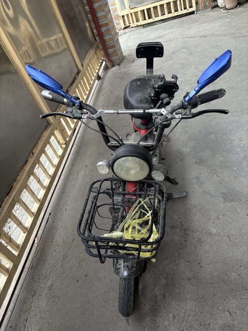 Electric Scooter with Basket and Mirrors (Category: Bicycles) located in Manila. Submitted by karengrace_27 (Listing ID 1438231331, Image 1). Description: - Red and black electric scooter - Front basket included - Features blue side mirrors - Comfortable black seat with backrest - Round headlight - Handlebar for easy steering - Convenient footrests - Sturdy kickstand - Functional and ready for use -charger.