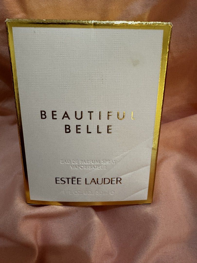 Estee Lauder Beautiful Belle Eau de Parfum 30ml (Category: Fragrance & Deodorants) located in Quezon City. Submitted by vibelane_shop (Listing ID 1438116210, Image 3). Description: Estee Lauder Beautiful Belle Eau de Parfum. The bottle contains a yellow liquid. The box is white and gold with the words "Beautiful Belle" and "Estee Lauder" printed! on it. The box also has a barcode. The perfume is 30ml bought in Trinoma Mall ************ 📝This is 