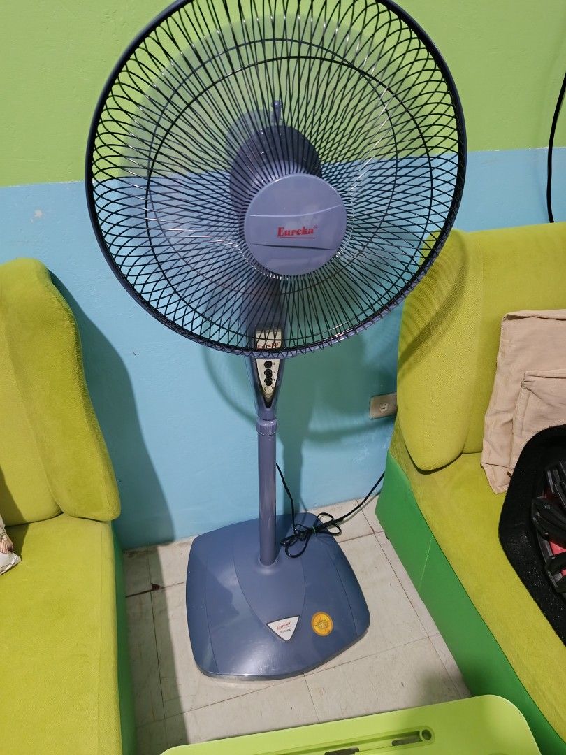 Eureka Stand Fan (Category: Fans) located in Manila. Submitted by jusmineaurigue (Listing ID 1438159044, Image 1). Description: - Eureka stand fan - Multiple speed settings - Adjustable height - Sturdy base - Stylish blue and black color scheme - Designed for home use - Controls located on fan body.