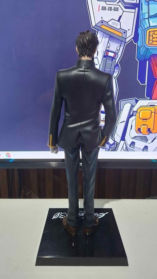 Evangelion Sega Gendo Ikari (Category: Figurines & Statues) located in Imus. Submitted by ToyBlazePH (Listing ID 1438215397, Image 3). Description: - Evangelion 3.0 Figure - Features a man in a black suit and red shirt - Includes sunglasses - Comes with a black base featuring the Evangelion 3.0 logo.