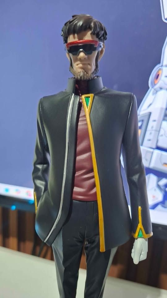 Evangelion Sega Gendo Ikari (Category: Figurines & Statues) located in Imus. Submitted by ToyBlazePH (Listing ID 1438215397, Image 1). Description: - Evangelion 3.0 Figure - Features a man in a black suit and red shirt - Includes sunglasses - Comes with a black base featuring the Evangelion 3.0 logo.