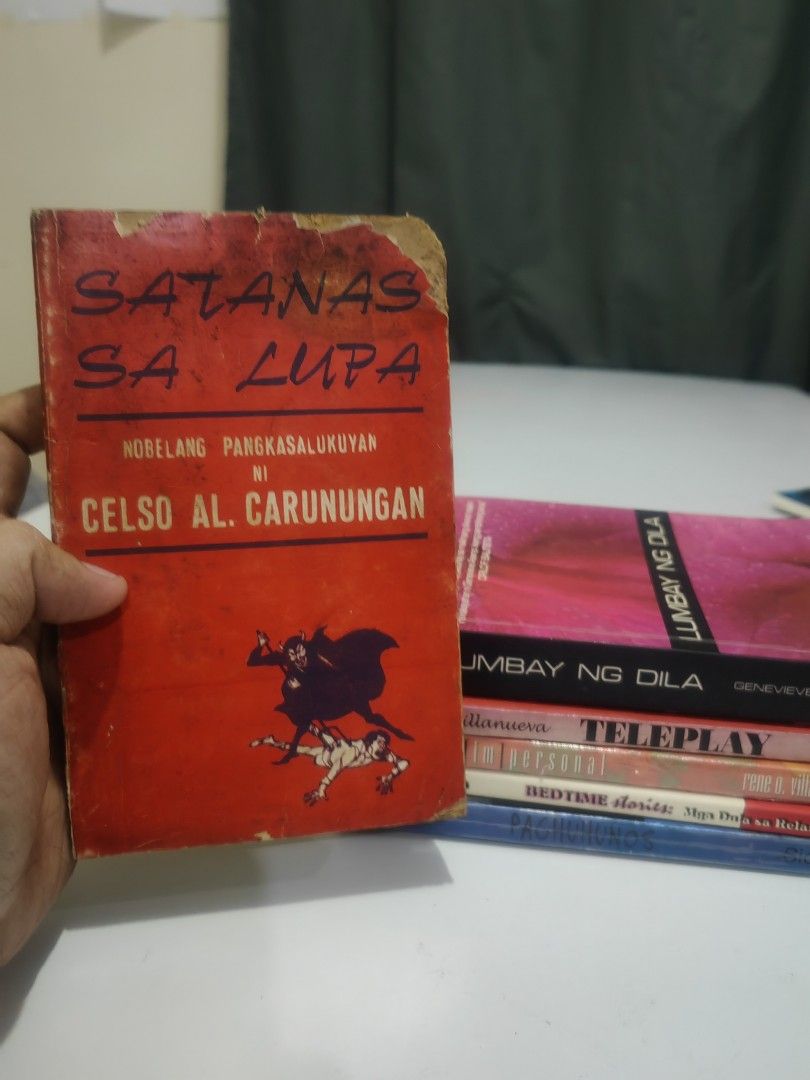 Filipino Books Bundle (Category: Storybooks) located in Naga. Submitted by bugoy_1988 (Listing ID 1438235045, Image 2). Description: - Bundle of Filipino books. - Includes "Satanas Sa Lupa" by Celso Al. Carunungan. - Features "Lumbay Ng Dila" by Genevieve L. Asenjo with Signature - Other titles included: "Teleplay," "Bedtime Stories," "Im Personal." - Books are in varying conditions..