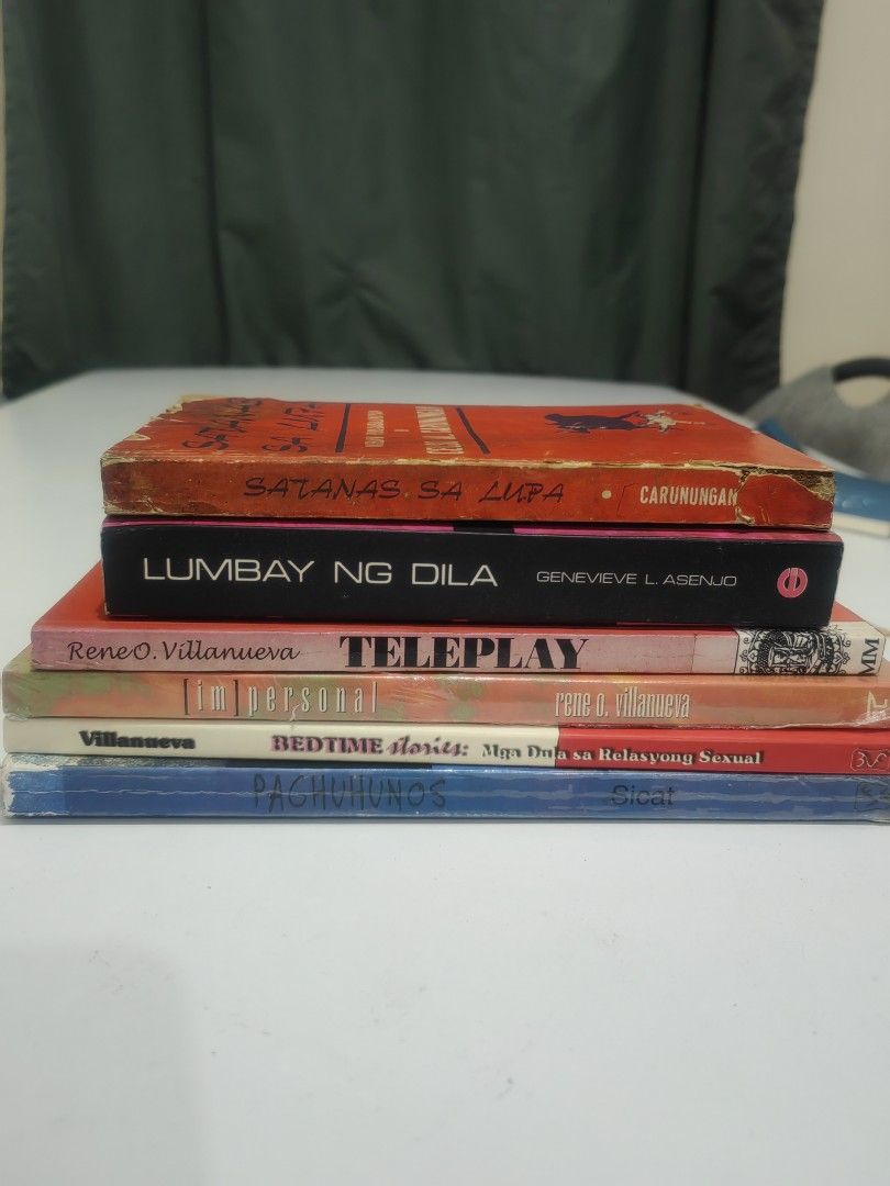 Filipino Books Bundle (Category: Storybooks) located in Naga. Submitted by bugoy_1988 (Listing ID 1438235045, Image 1). Description: - Bundle of Filipino books. - Includes "Satanas Sa Lupa" by Celso Al. Carunungan. - Features "Lumbay Ng Dila" by Genevieve L. Asenjo with Signature - Other titles included: "Teleplay," "Bedtime Stories," "Im Personal." - Books are in varying conditions..