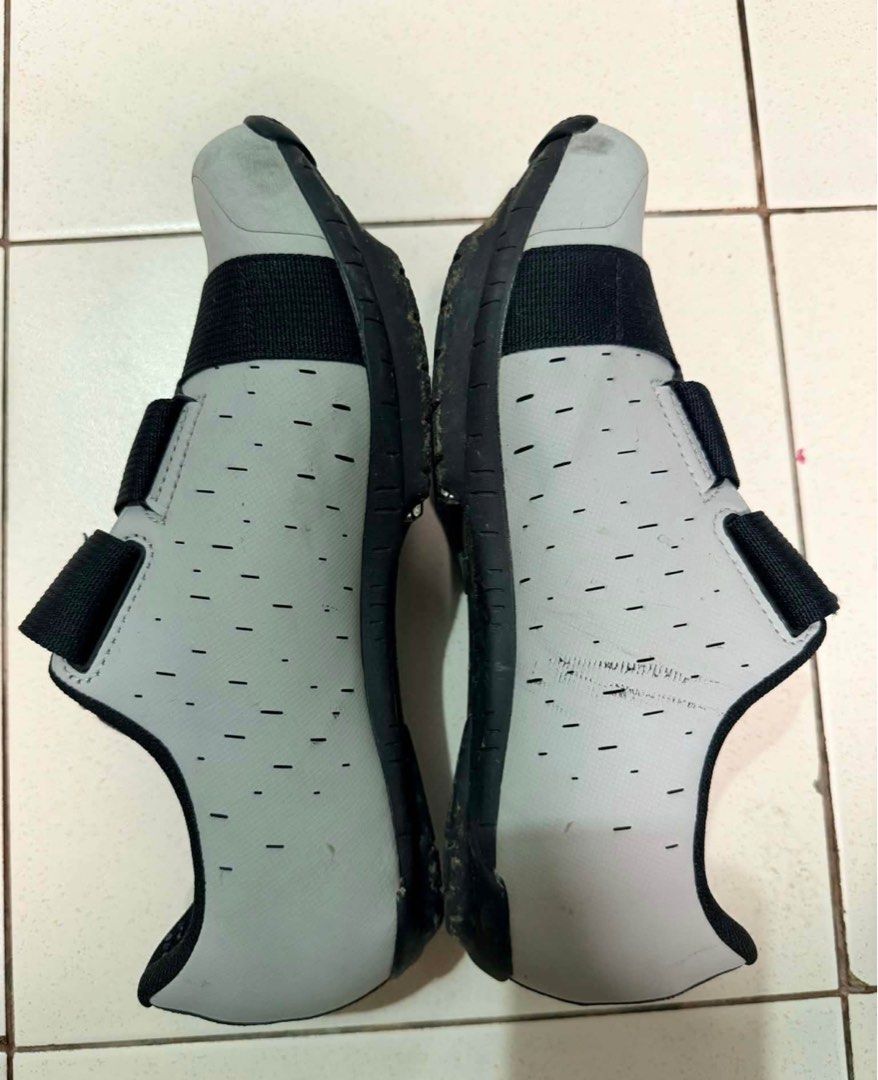 Fizik Terra Cycling Shoes (Category: Other Sports Equipment and Supplies) located in Binan City. Submitted by trendytots (Listing ID 1438165097, Image 2). Description: - Fizik Terra cycling shoes - Size 41 - Color: Grey and black - Features velcro straps - Perforated design for breathability - Cleats on soles for pedal attachment.