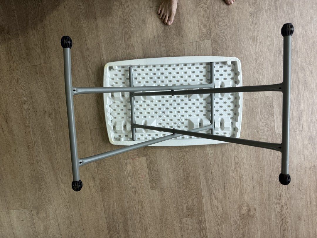 Foldable White Table (Category: Tables & Sets) located in Singapore. Submitted by tonykwon (Listing ID 1438136559, Image 3). Description: - Foldable and lightweight plastic table. not adjustable，not for kid - Easy to set up and store. - Functional and sturdy. - Surface has some markings (refer to pictures). -75*50cm .