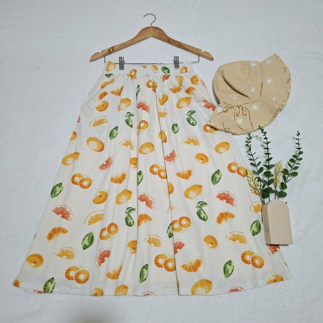 Free shipping!Fruit Print Skirt (Category: Skirts) located in Batangas. Submitted by sell_ph (Listing ID 1438257764, Image 1). Description: - Maxi skirt with vibrant fruit print - Comfortable elastic waistband - Lined with a lighter fabric - Features orange, grapefruit, and green leaf patterns - Flowy and lightweight design - Ideal for warm weather.