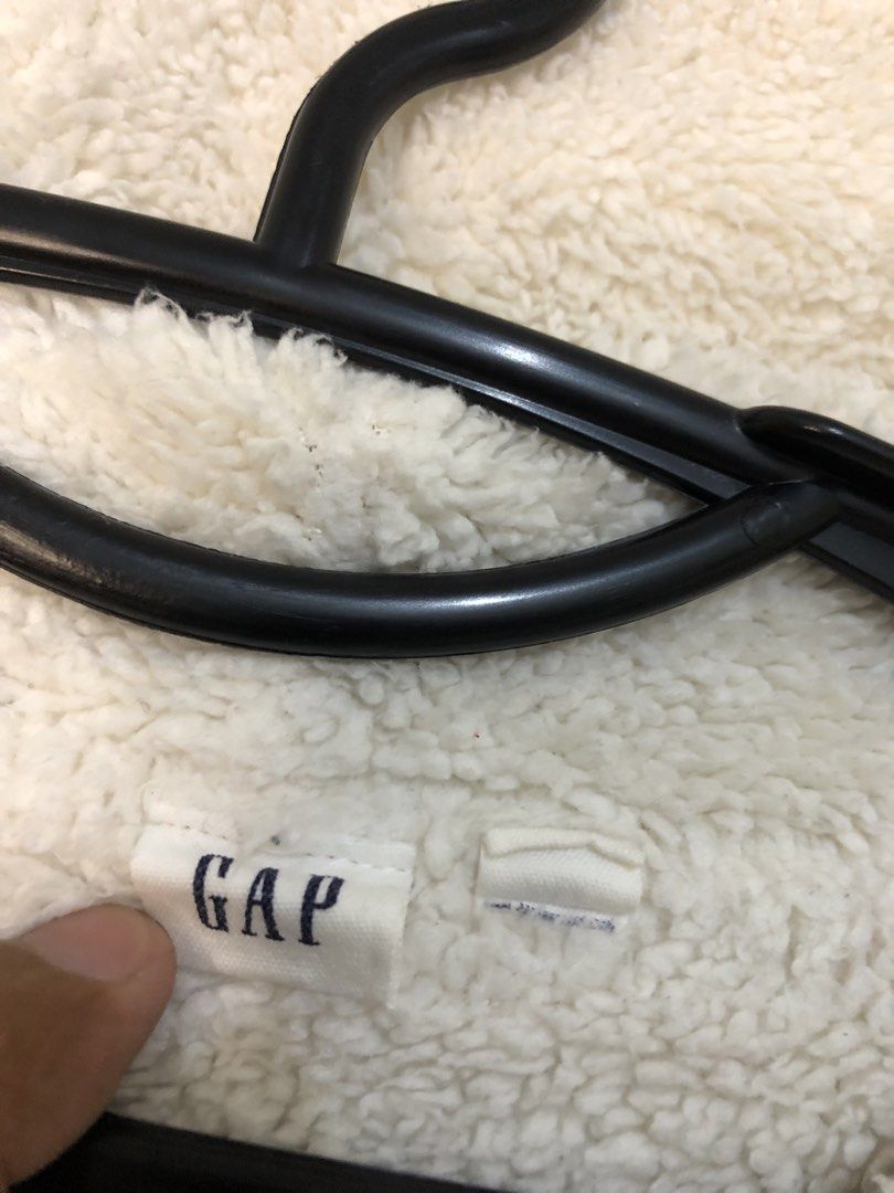 GAP Zip-Up Hoodie (Category: Hoodies) located in Manila. Submitted by kosathrifted. (Listing ID 1438280913, Image 3). Description: - White GAP zip-up hoodie - Fleece-lined hood - GAP logo on front - Zipper closure - Two front pockets - Standard fit - Tag visible.