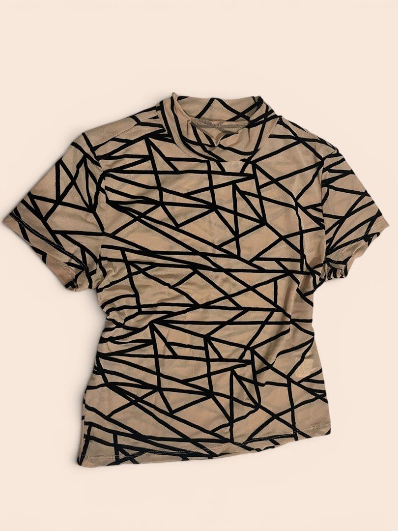 Geometric Print Mock Neck T-shirt (Category: Blouses) located in Quezon City. Submitted by vickieest (Listing ID 1438192054, Image 1). Description: - Beige t-shirt with a unique geometric design. - Features a mock neck. - Short sleeves. - Made of lightweight material. - Ideal for casual wear..