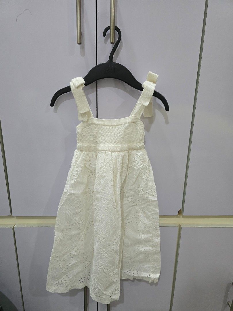 Gingersnaps White Eyelet Dress (Category: Babies & Kids Fashion) located in San Jose. Submitted by shobe__ (Listing ID 1438118507, Image 1). Description: - Gingersnaps eyelet dress - White color - Halter neck design - Fitted waist - Lightweight fabric - Suitable for special occasions and casual wear.