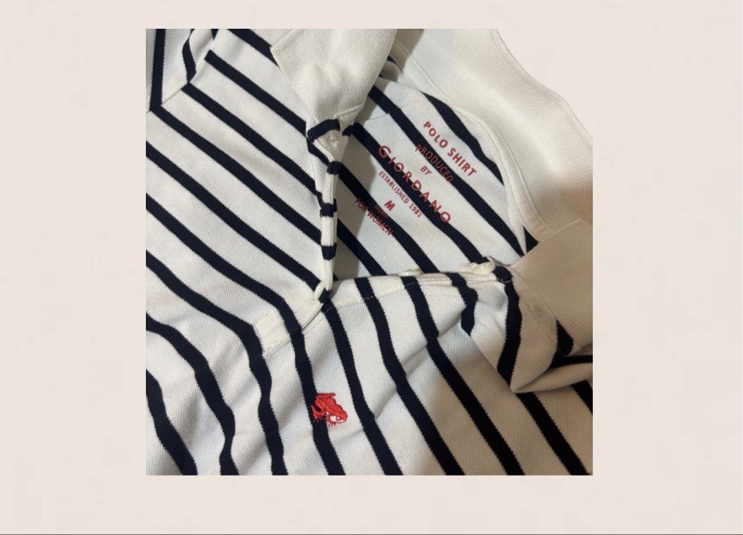 Giordano Striped Polo Shirt - Medium (Category: Tshirts & Polo Shirts ) located in Davao. Submitted by _manuella (Listing ID 1438127970, Image 3). Description: - Giordano polo shirt for women - Size: Medium - Features a white collar - Red Giordano logo on the chest - Striped pattern in white and navy blue.