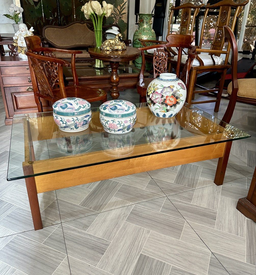 Glass Top Coffee Table (Category: Tables & Sets) located in Quezon City. Submitted by cddelarrazabal (Listing ID 1438191805, Image 3). Description: #greatasianfinds A striking rectangular wooden coffee table with glass top, showcasing a clean, architectural silhouette. The exposed wooden supports beneath the glass highlight its minimalist, structural design—a look often associated with mid-century modern and brutalist influences. Size: 48” L x 29