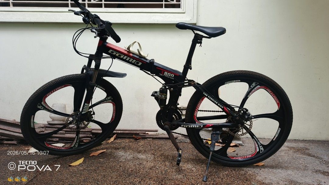 Goma X800 Folding Bike (Category: Bicycles) located in Manila. Submitted by jhaylex_0422 (Listing ID 1438122725, Image 1). Description: - Goma X800 folding bike - Black and red color - Disc brakes - Kickstand - Black rims with red accents - Good working condition - Ready to use.