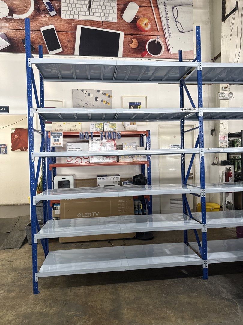 Heavy Duty Metal Shelving Unit (Category: Shelves, Cabinets & Racks) located in Manila. Submitted by joylontok16 (Listing ID 1438161449, Image 2). Description: - Sturdy metal shelving unit - Features multiple shelves for organization - Blue frame with silver shelves - Perfect for warehouses, shops, and home use - Provides ample storage space - Built to last.