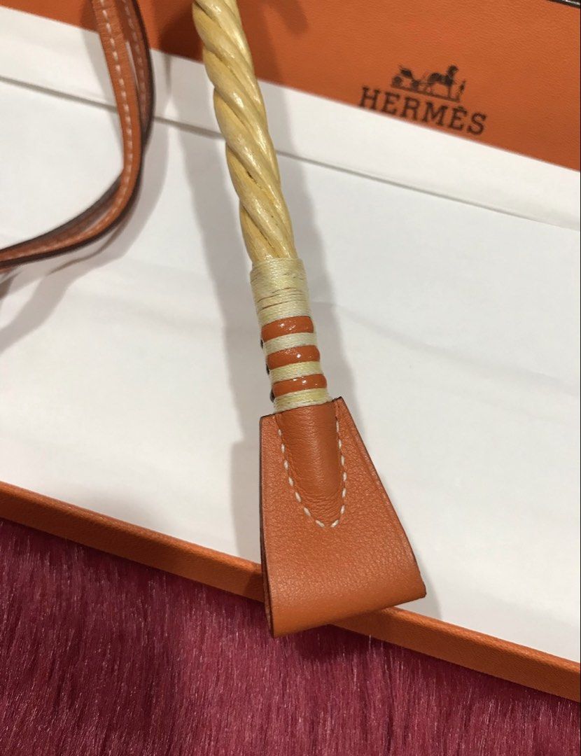 HERMES Rare Cravac Whip Bag Charm (Category: Charms) located in Quezon City. Submitted by venchar (Listing ID 1438140202, Image 3). Description: HERMES Rare Cravac Whip Bag Charm Color: Orange Leather and Wood Brand New Complete with box and paper bag #hermes #hermesph #hermesaccessories #hermesbagcharm.