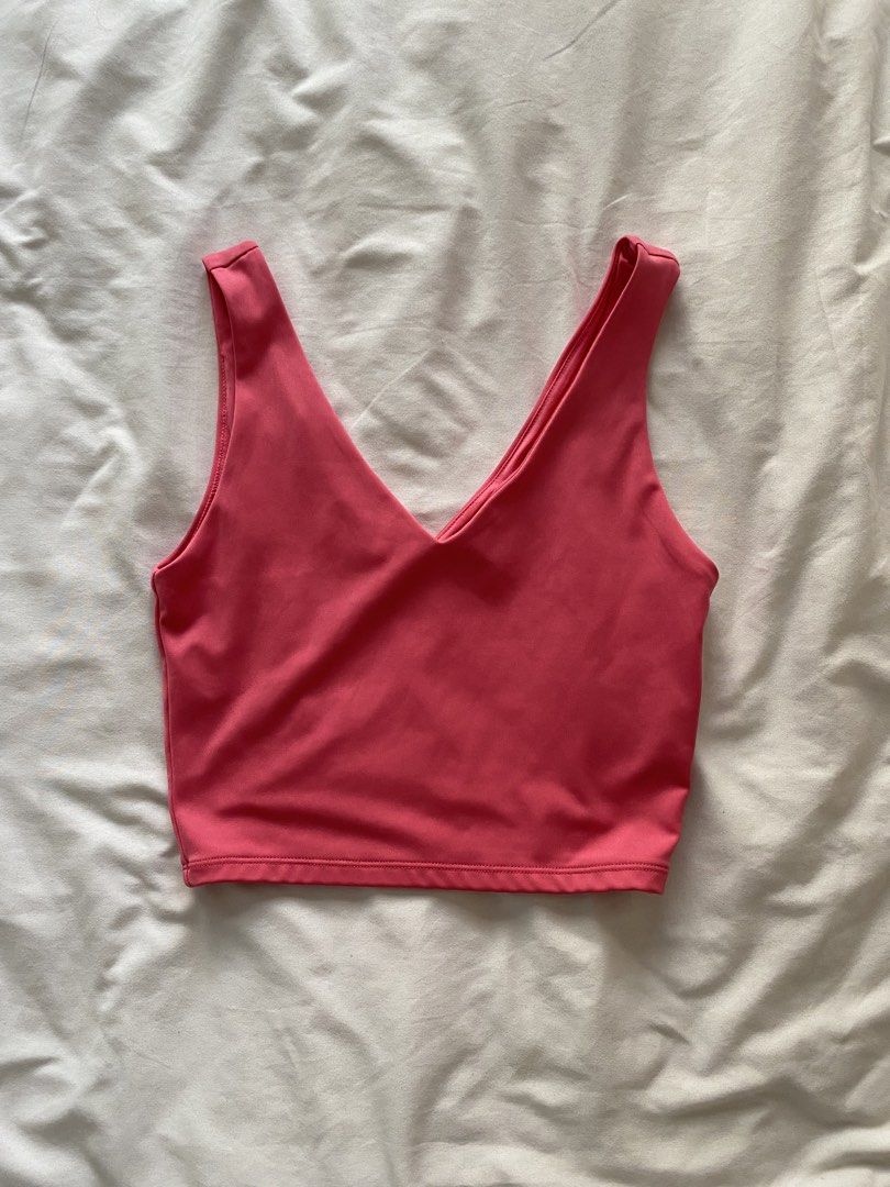 H&M Pink Crop Top XS (Category: Sleeveless) located in Quezon City. Submitted by ashleyken (Listing ID 1438172968, Image 1). Description: - H&M Pink Crop Top - Size: XS - Design: V-neck - Color: Solid Pink - Material: Smooth, likely for warm weather - Versatile: Pairs well with different bottoms.