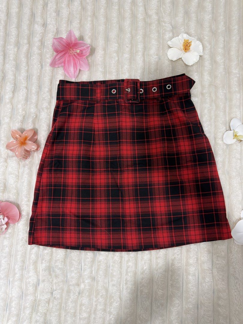 H&M Red Plaid Skirt (Category: Skirts) located in Pasig City. Submitted by jamie.sebuc (Listing ID 1438150114, Image 1). Description: - H&M plaid skirt (red & black) - Features a belt with eyelet details - Classic plaid pattern - Flattering A-line shape - Original price: ₱899 - Perfect for a chic outfit.