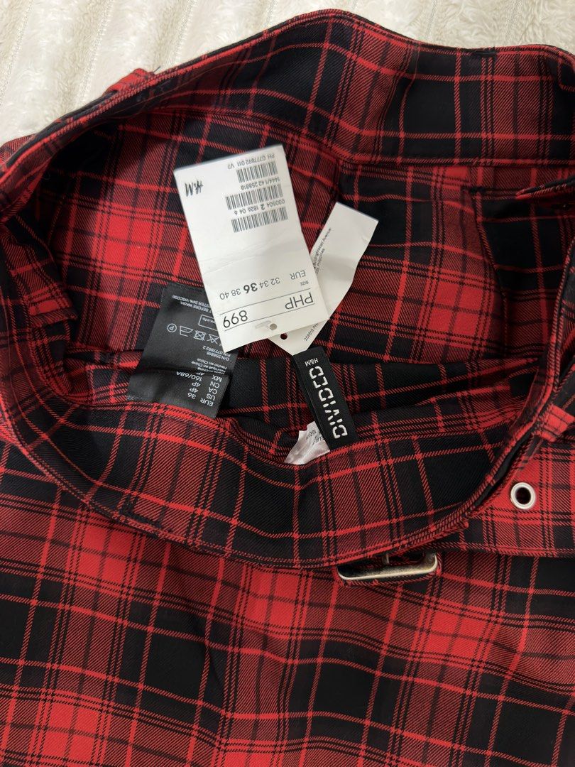 H&M Red Plaid Skirt (Category: Skirts) located in Pasig City. Submitted by jamie.sebuc (Listing ID 1438150114, Image 3). Description: - H&M plaid skirt (red & black) - Features a belt with eyelet details - Classic plaid pattern - Flattering A-line shape - Original price: ₱899 - Perfect for a chic outfit.