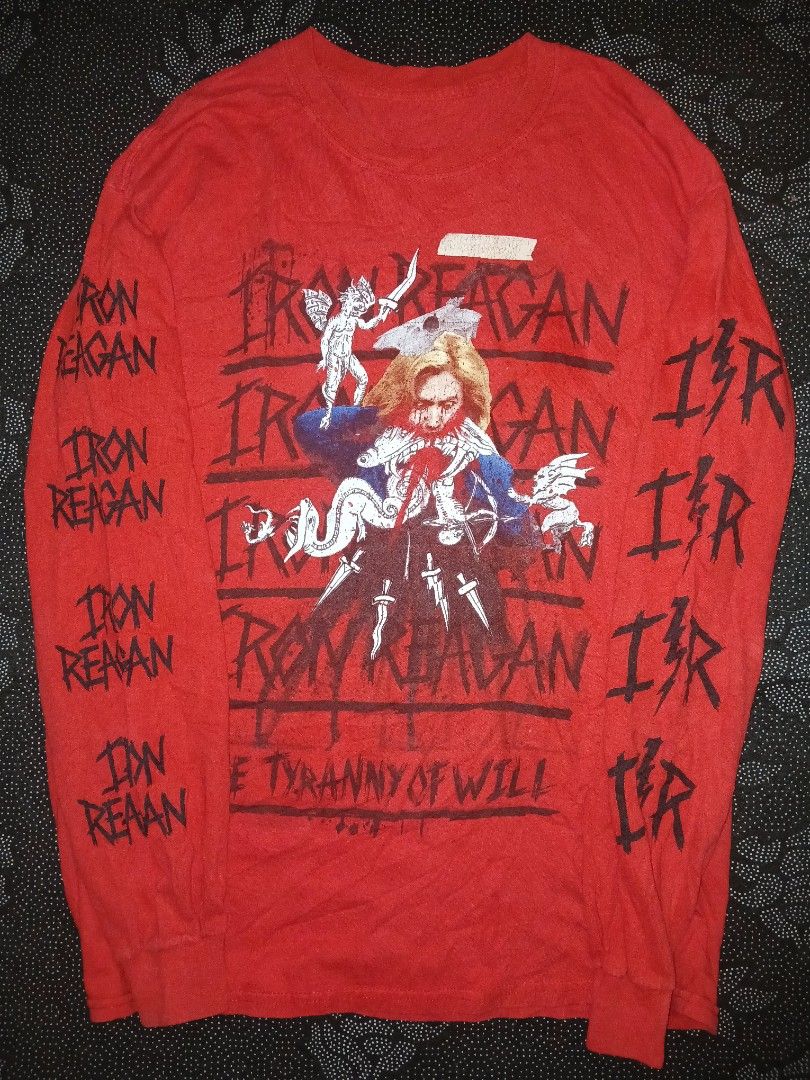 Iron reagan band ls (Category: Longsleeves) located in Caloocan City. Submitted by benthriftshp (Listing ID 1438263012, Image 1). Description: iron reagan band tee - Red long sleeve shirt - Graphic print on front and sleeves - "THE TYRANNY OF WILL" text on the back Soft, possibly cotton, material - Crew neck - Ribbed cuffs 21x28.6 dimes 2 pinholes 700+sf.