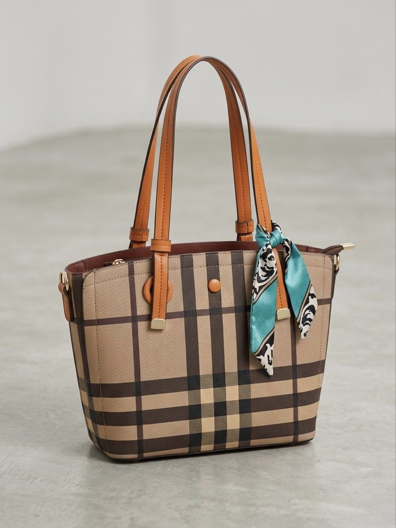 Jovanni Check Tote Bag (Category: Luxury Bags & Wallets) located in Manila. Submitted by crizhia.s (Listing ID 1438129735, Image 2). Description: - Iconic check pattern - Brown leather handles and trim - Decorative scarf detail - Zip closure - Structured shape - Medium size - Ideal for everyday use - Comes with a small check cosmetic bag Bought from SM Store for ₱3,200 RFS: Can't fit iPad so it is barely used.