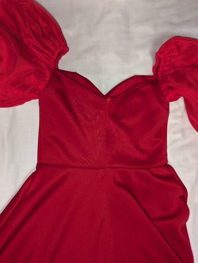Karimadon Red Off-Shoulder Dress (Category: Dresses) located in Quezon City. Submitted by llue_ (Listing ID 1438191898, Image 3). Description: - Karimadon red dress - Off-shoulder design - Puffy sleeves - Fitted bodice - Flared mid-calf skirt - Back zipper closure - Perfect for special occasions Excellent condition. Worn once, very clean, and well-maintained. Send a DM if you want more photos or details. Ready to ship! ✨.