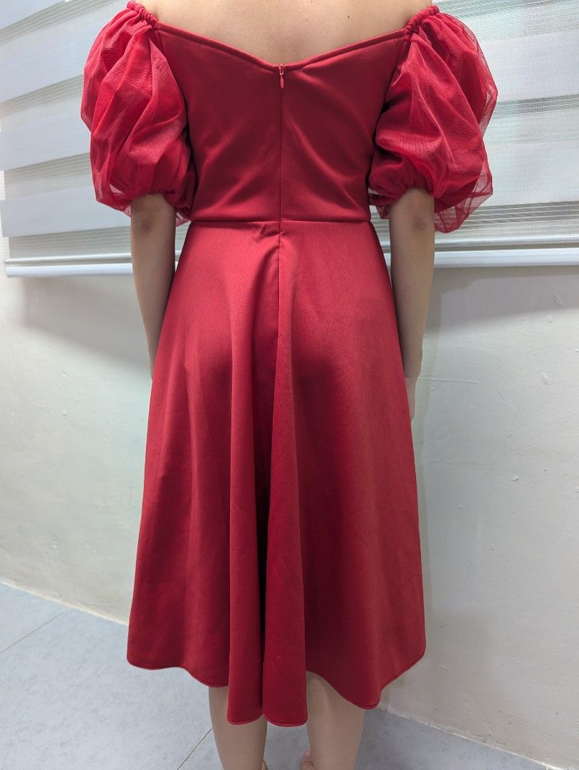 Karimadon Red Off-Shoulder Dress (Category: Dresses) located in Quezon City. Submitted by llue_ (Listing ID 1438191898, Image 2). Description: - Karimadon red dress - Off-shoulder design - Puffy sleeves - Fitted bodice - Flared mid-calf skirt - Back zipper closure - Perfect for special occasions Excellent condition. Worn once, very clean, and well-maintained. Send a DM if you want more photos or details. Ready to ship! ✨.