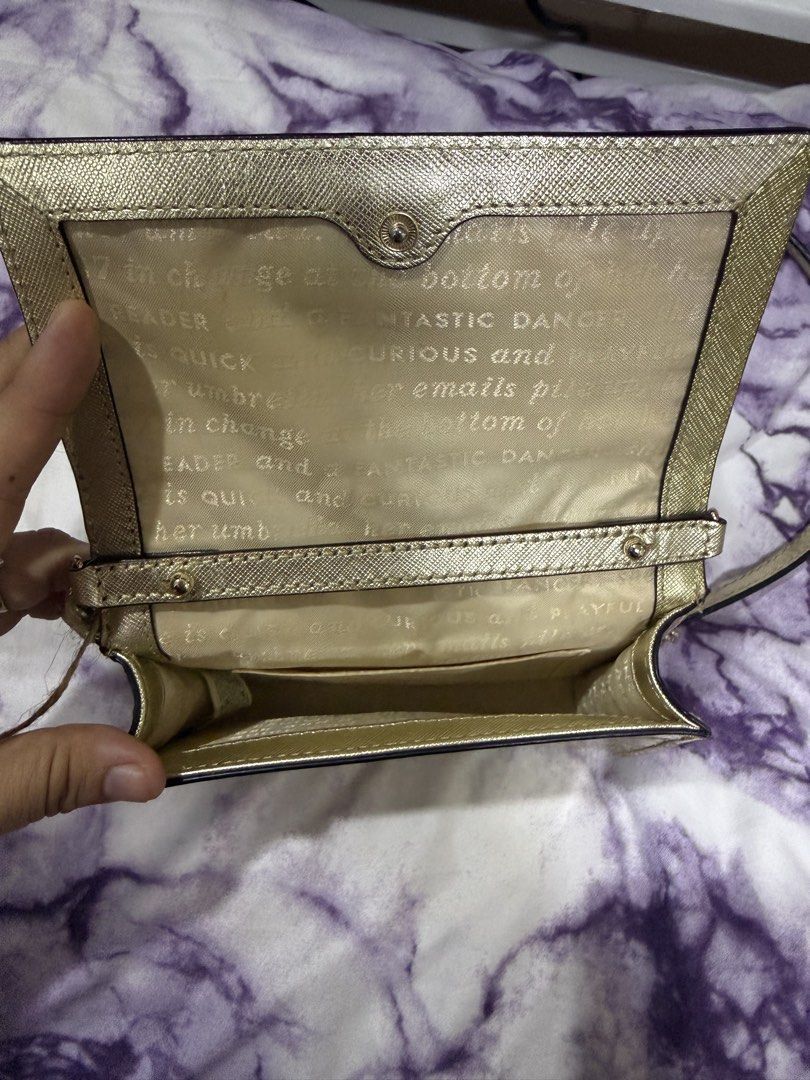 Kate Spade Glitter Crossbody Bag (Category: Luxury Bags & Wallets) located in Taguig. Submitted by maicacu90 (Listing ID 1438224818, Image 3). Description: - Kate Spade crossbody bag - Dazzling glitter exterior - Flap closure - Gold-toned chain strap - Light-colored fabric lining - Includes tag - Stylish accessory.