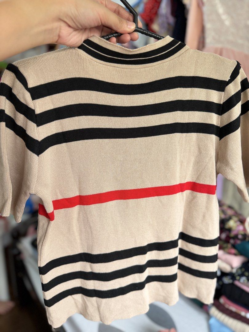 Knitted Striped Soft Knit Top with Tie (Category: Blouses) located in Paranaque City. Submitted by khamsay (Listing ID 1438211719, Image 2). Description: - Beige knit top with black and red stripes - Short sleeves - Tie detail at neckline - Mock neck design - Soft knit material.