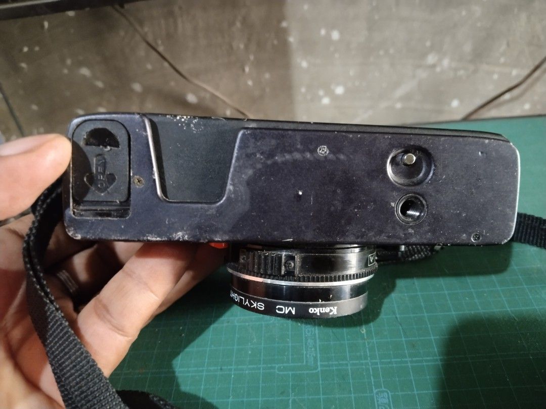 Konica C35 EF Film Camera (Category: Cameras) located in Manila. Submitted by megazordbuilderhunter (Listing ID 1438168222, Image 3). Description: - Konica C35 EF film camera - 38mm f/2.8 Konica Hexanon lens - Built-in flash - Includes camera strap - ASA setting - Accessible film compartment - Black camera body.
