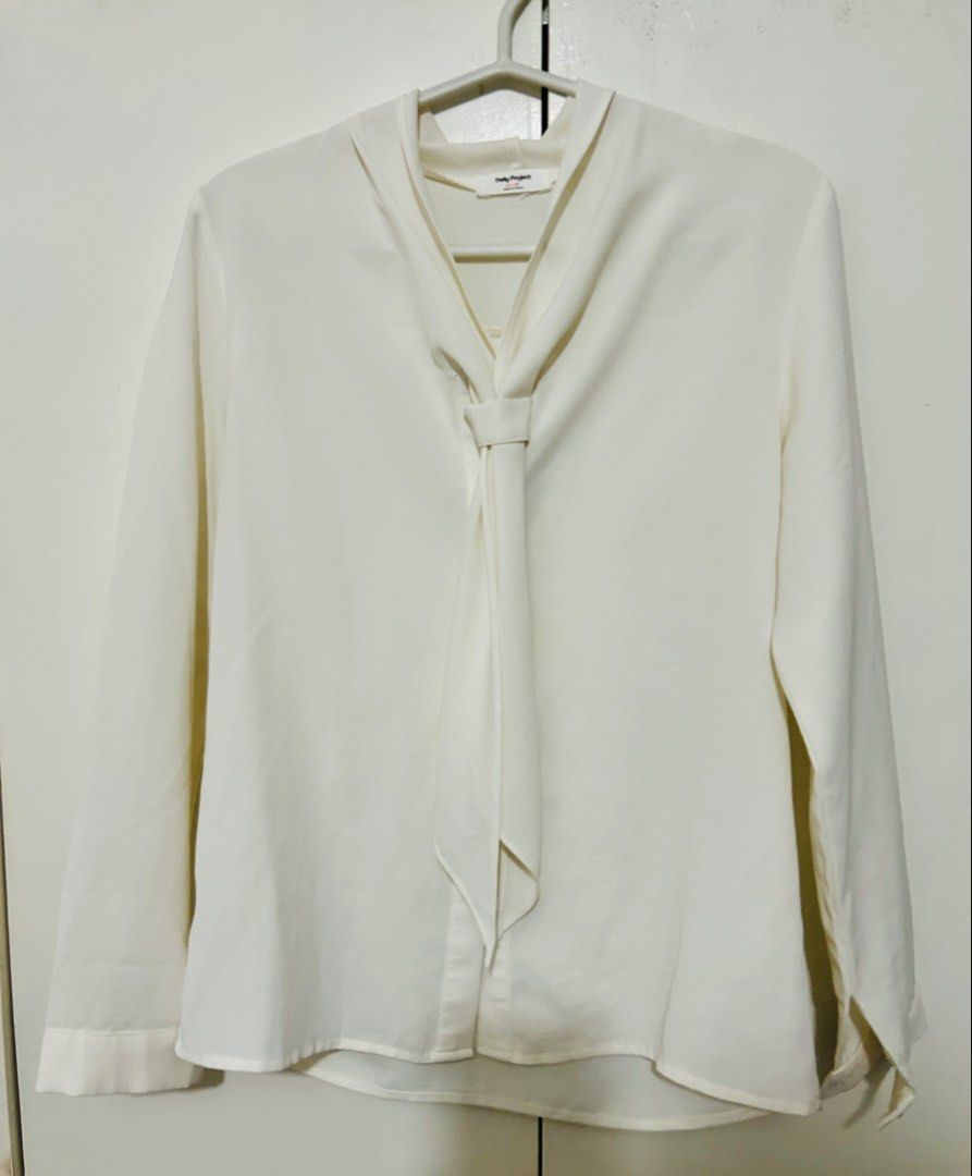 Korean Cream Long sleeves Blouse (Category: Blouses) located in Quezon City. Submitted by closetgoodeez (Listing ID 1438240087, Image 1). Description: *FOR SALE PRELOVED BLOUSE * - long sleeves cream blouse - Tie-neck design - Long sleeves - Button-down front - Relaxed fit - Made in Korea - Lightweight fabric - Classic and versatile style - LENGTH: approx. 24 inches - sleeve length: 21 inches * No reservations/holds * Payment required to secure i