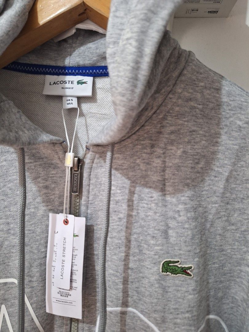 Lacoste hoodie gray zip up (Category: Coats, Jackets and Outerwear) located in Muntinlupa City. Submitted by kstefanomela14 (Listing ID 1438167375, Image 2). Description: brandnew Legit Lacoste zip pullover hoodie small - 20 x 26 Large - 21.5 x 27.5 Xxl - 23.5 x 29 Cod Cop Lbc lalamove j&t.