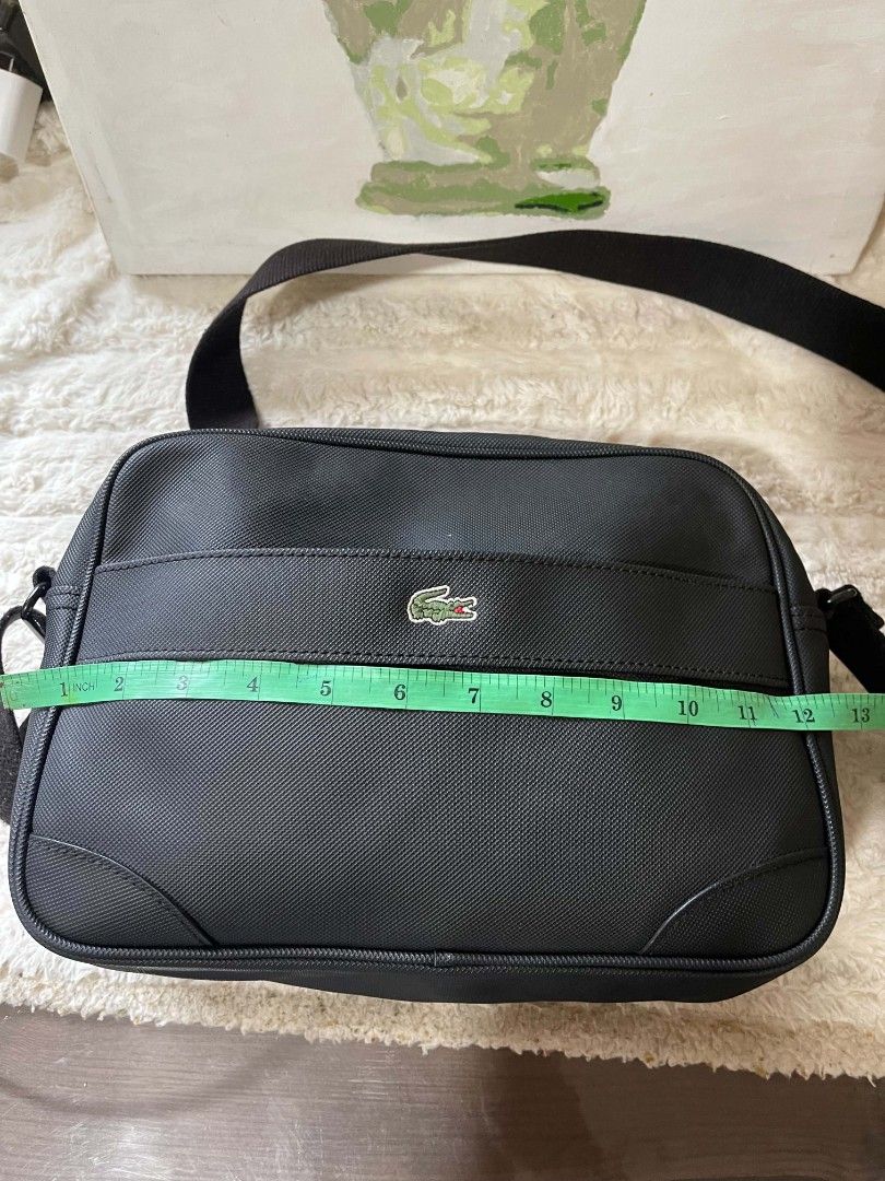 Lacoste Sling bag for men Original (Category: Sling Bags) located in Naawan. Submitted by twillycalledprelovedbags (Listing ID 1438159611, Image 3). Description: issue: nag bakbak Ang kanyang creed sa loob, and may konting dirt sa loob.