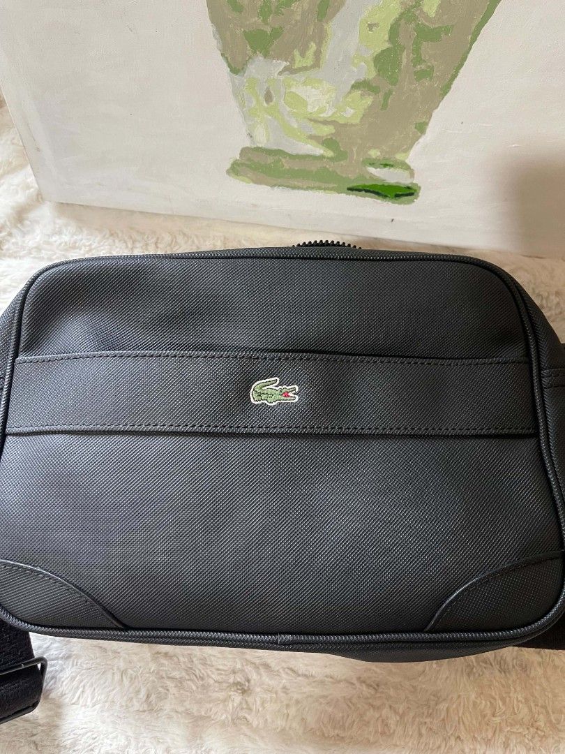 Lacoste Sling bag for men Original (Category: Sling Bags) located in Naawan. Submitted by twillycalledprelovedbags (Listing ID 1438159611, Image 2). Description: issue: nag bakbak Ang kanyang creed sa loob, and may konting dirt sa loob.
