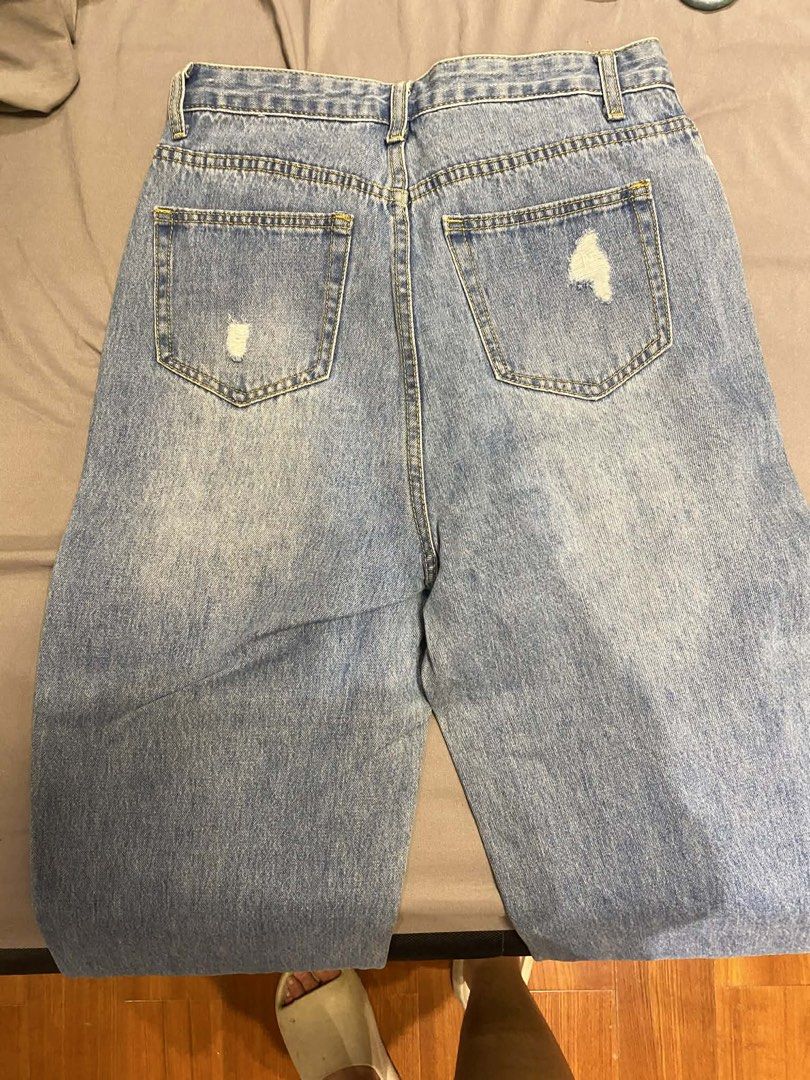 Light Wash Jeans (Category: Jeans) located in Caloocan City. Submitted by b4wang (Listing ID 1438165798, Image 3). Description: - Light wash denim jeans - Distressed details - Classic five-pocket design - Straight leg fit - Ripped details on front and back - Button and zipper closure waist band length 14” length from waist band 37”.