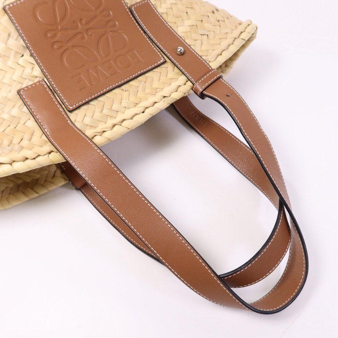 Loewe Basket Bag (Category: Luxury Bags & Wallets) located in Taguig. Submitted by sourcedbym (Listing ID 1438113205, Image 3). Description: - Authentic Loewe Basket Bag - Woven straw body - Brown leather handles and logo patch - Structured shape - Spacious interior - Ideal for daily use.