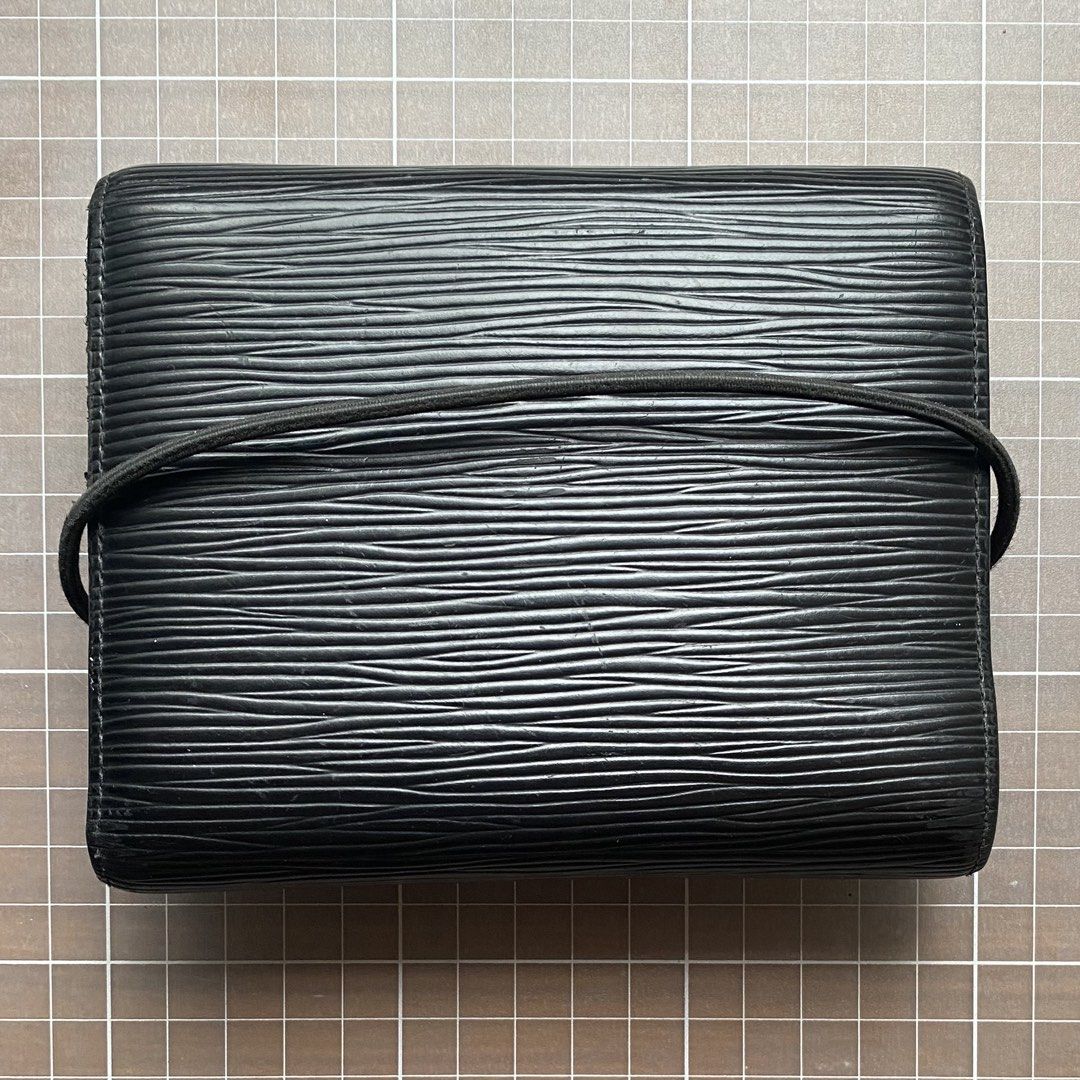 Louis Vuitton Epi Leather Wallet (Category: Luxury Bags & Wallets) located in Manila. Submitted by club75 (Listing ID 1438188314, Image 2). Description: Authentic Louis Vuitton Epi Leather Wallet Features: - Multiple card slots - Coin compartment - Black elastic band closure - Visible Louis Vuitton logo Slightly negotiable.