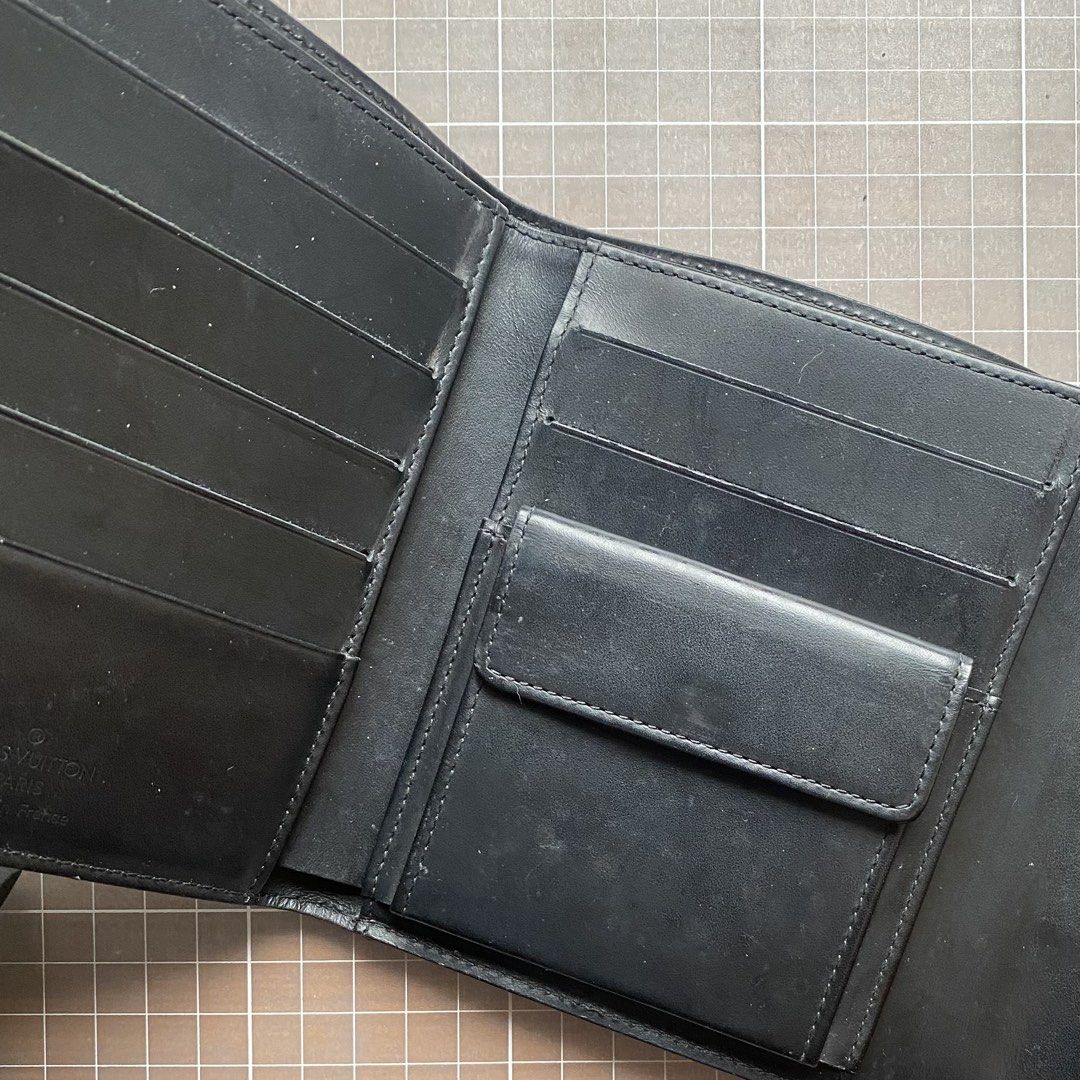 Louis Vuitton Epi Leather Wallet (Category: Luxury Bags & Wallets) located in Manila. Submitted by club75 (Listing ID 1438188314, Image 3). Description: Authentic Louis Vuitton Epi Leather Wallet Features: - Multiple card slots - Coin compartment - Black elastic band closure - Visible Louis Vuitton logo Slightly negotiable.