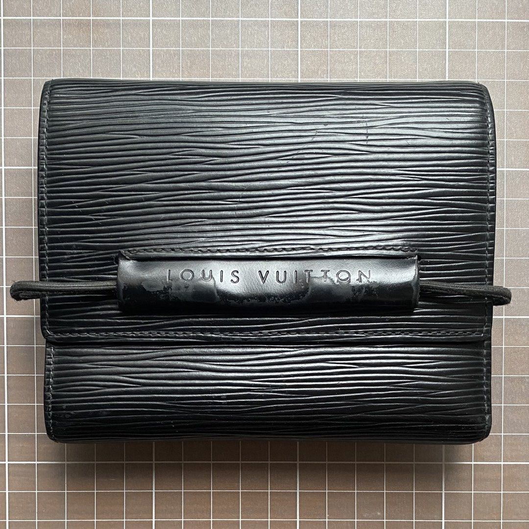 Louis Vuitton Epi Leather Wallet (Category: Luxury Bags & Wallets) located in Manila. Submitted by club75 (Listing ID 1438188314, Image 1). Description: Authentic Louis Vuitton Epi Leather Wallet Features: - Multiple card slots - Coin compartment - Black elastic band closure - Visible Louis Vuitton logo Slightly negotiable.