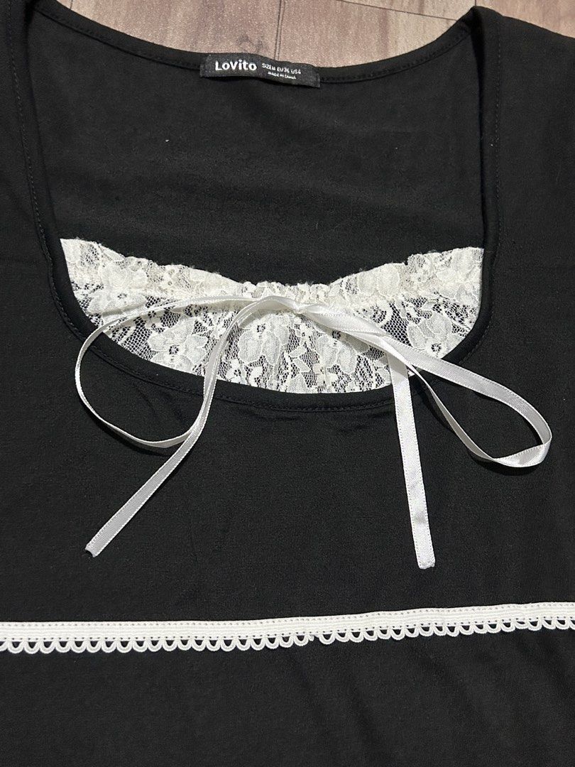 Lovito Black Lace Trim Top (Category: Blouses) located in Manila. Submitted by ashlynganda (Listing ID 1438299114, Image 2). Description: - Lovito black top - White lace trim and ribbon details - Square neckline - Short sleeves with ribbon ties - White lace accent on chest - White trim at waist - Size: S-M.