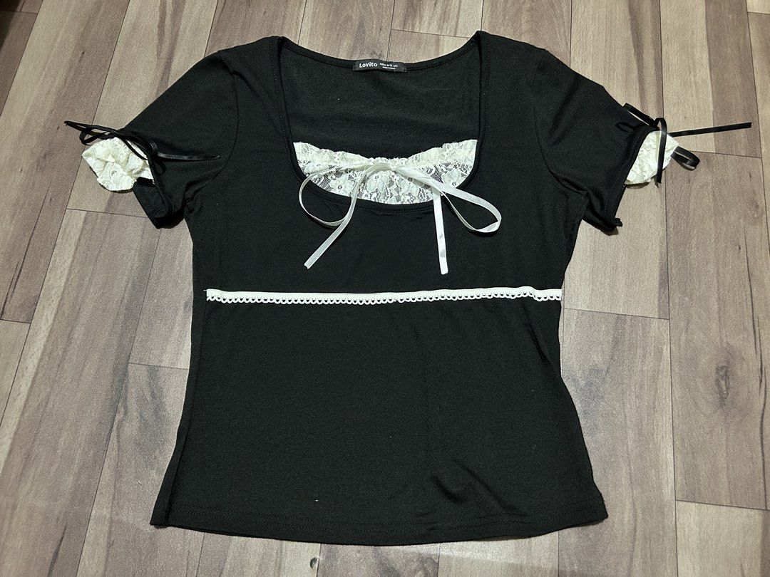 Lovito Black Lace Trim Top (Category: Blouses) located in Manila. Submitted by ashlynganda (Listing ID 1438299114, Image 1). Description: - Lovito black top - White lace trim and ribbon details - Square neckline - Short sleeves with ribbon ties - White lace accent on chest - White trim at waist - Size: S-M.