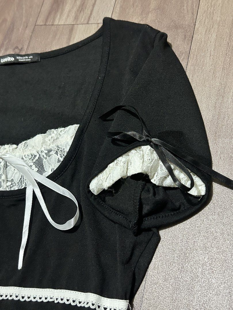 Lovito Black Lace Trim Top (Category: Blouses) located in Manila. Submitted by ashlynganda (Listing ID 1438299114, Image 3). Description: - Lovito black top - White lace trim and ribbon details - Square neckline - Short sleeves with ribbon ties - White lace accent on chest - White trim at waist - Size: S-M.