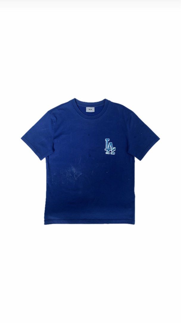 MLB Los Angeles Dodgers T-shirt (Category: Tshirts & Polo Shirts ) located in Zamboanga. Submitted by dherick38 (Listing ID 1438182832, Image 1). Description: - Blue Los Angeles Dodgers T-shirt - Features the iconic LA logo - Classic crew neck design - Short sleeves - Minor stains on the front - Authentic MLB merchandise.
