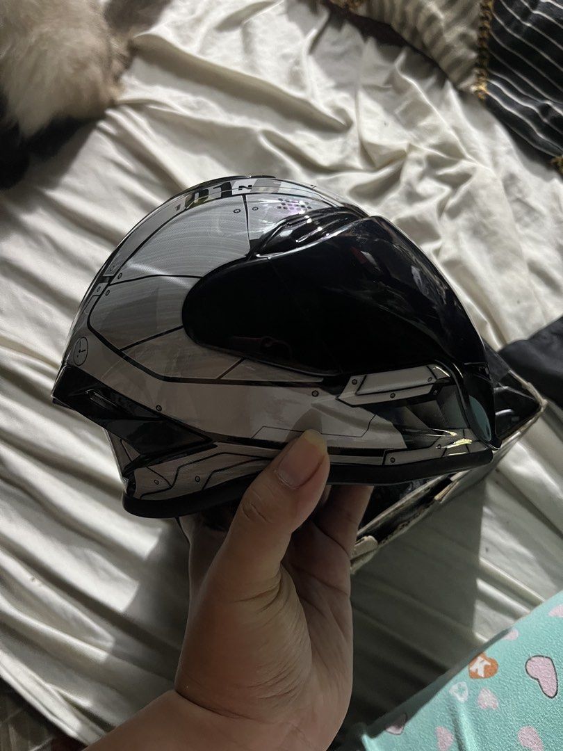 Motorcycle CAT Helmet - Black and Silver (Category: Homes & Other Pet Accessories) located in Manila. Submitted by goose_bear (Listing ID 1438301510, Image 2). Description: Stylish CAT motorcycle helmet with a sleek black and silver design. Features a dark visor for sun protection. The helmet has a unique geometric pattern on the top and sides. loc. Antipolo/Pasay.